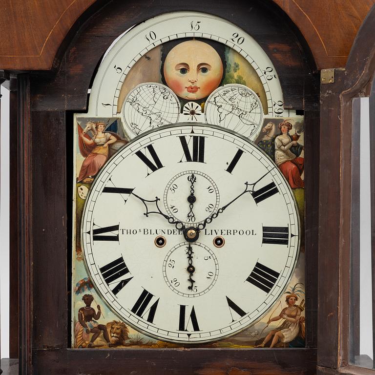 A long-case clock, England, 19th century.