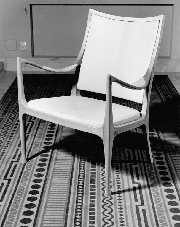 A Hans Asplund walnut and leather easy chair, exclusively made for the beauty parlour at Nordiska Kompaniet, 1955.