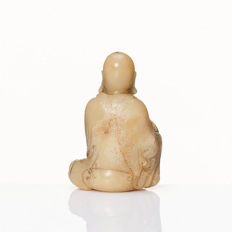 A Chinese carved nephrite sculpture of a man, 20th Century.