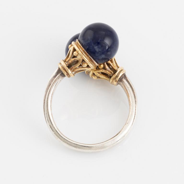 An Ilias Lalaounis ring in silver and 18K gold with sodalite.