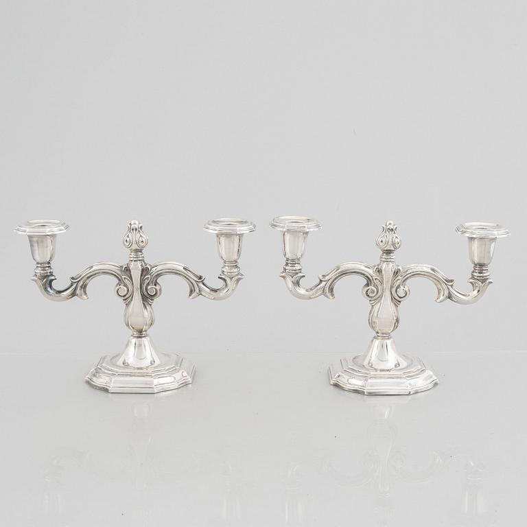 A pair of Swedish silver candelabras, marks of CG Hallberg, Stockholm 1959.