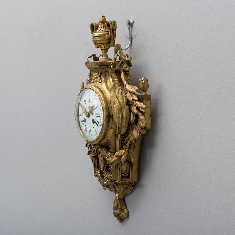 A brass wall clock marked A.W. Bruuns eftr, Lund from around year 1900.