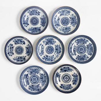 A set of seven blue and white 'Chinese Export' saucers, Qing dynasty, Jiaqing (1796-1820).