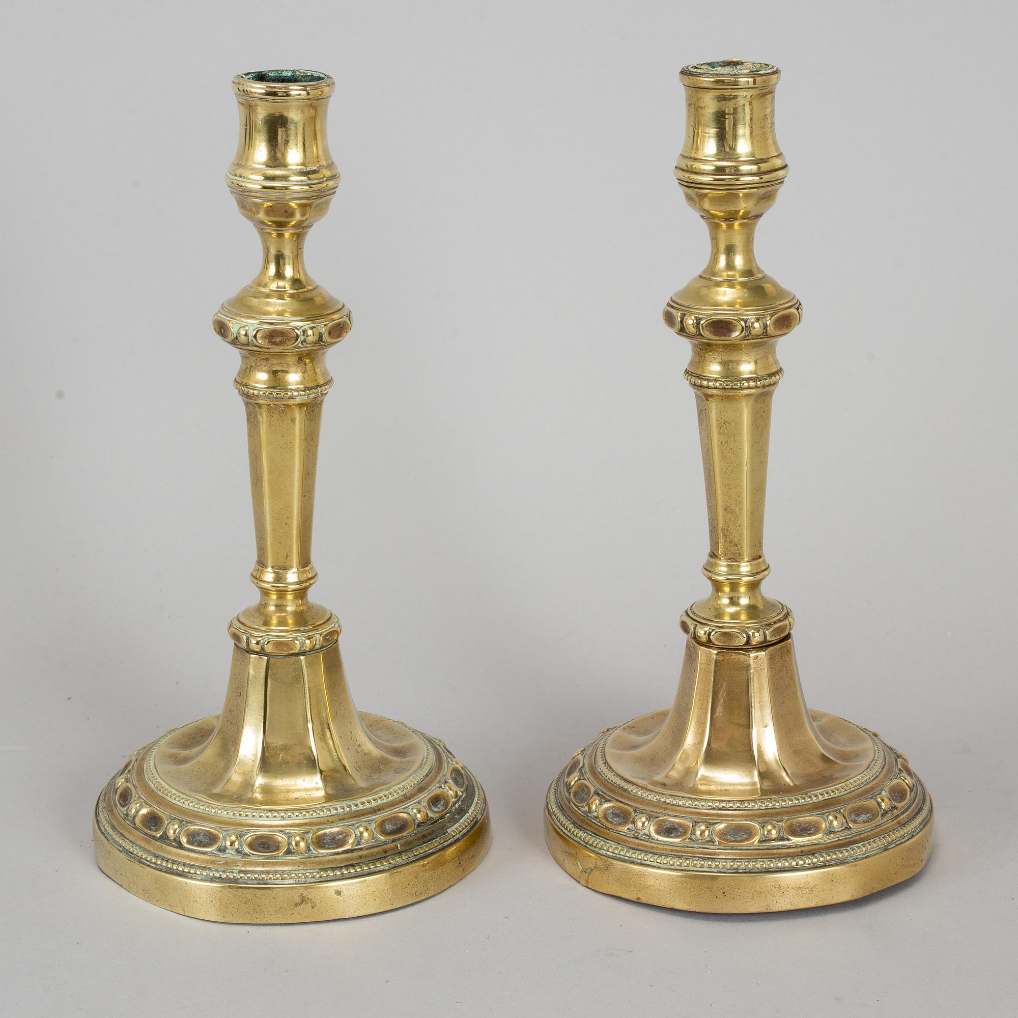 A pair of Louis Seize bronze candlesticks, late 18th century.