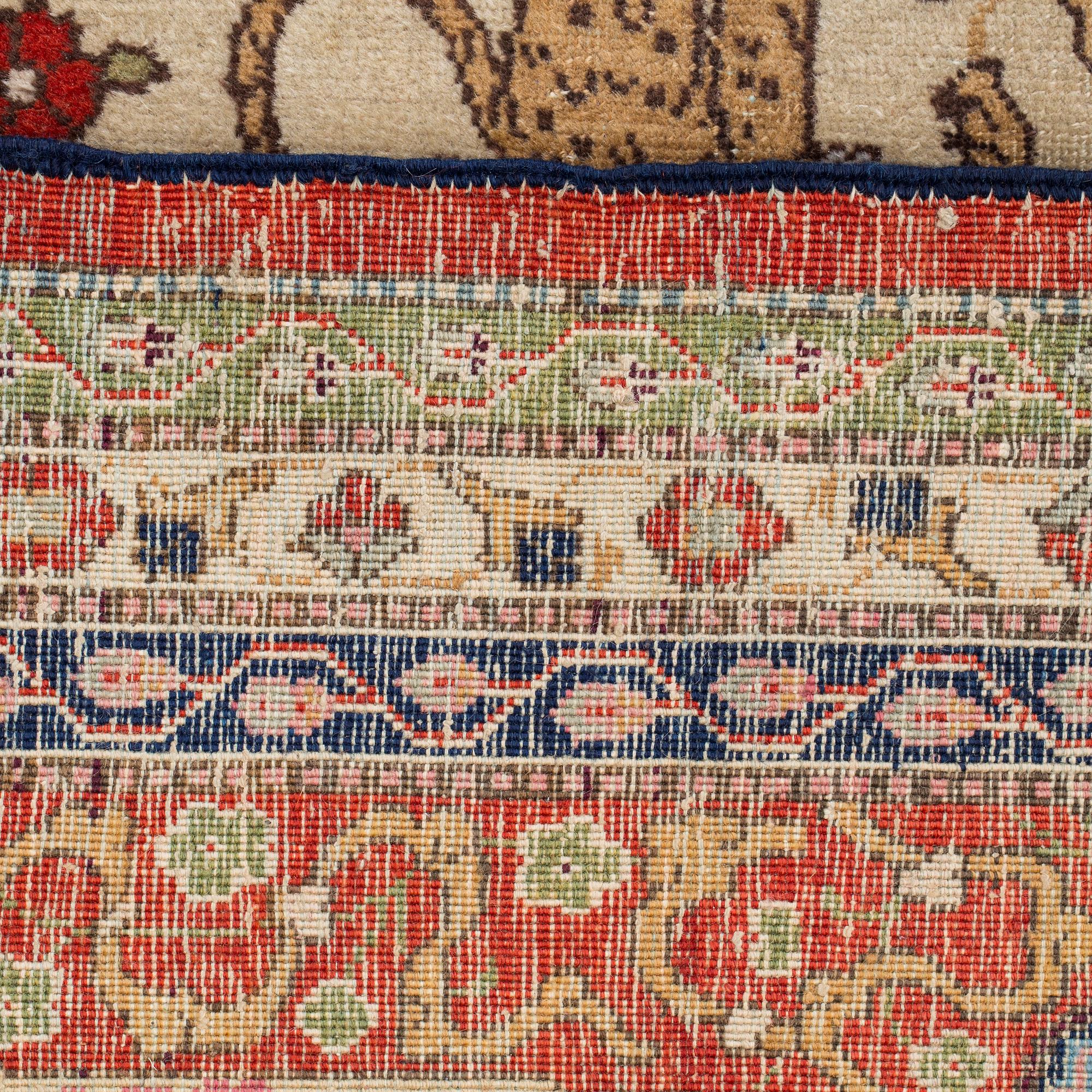 A CARPET, a semi-antique Tabriz, around 422 x 310 cm.