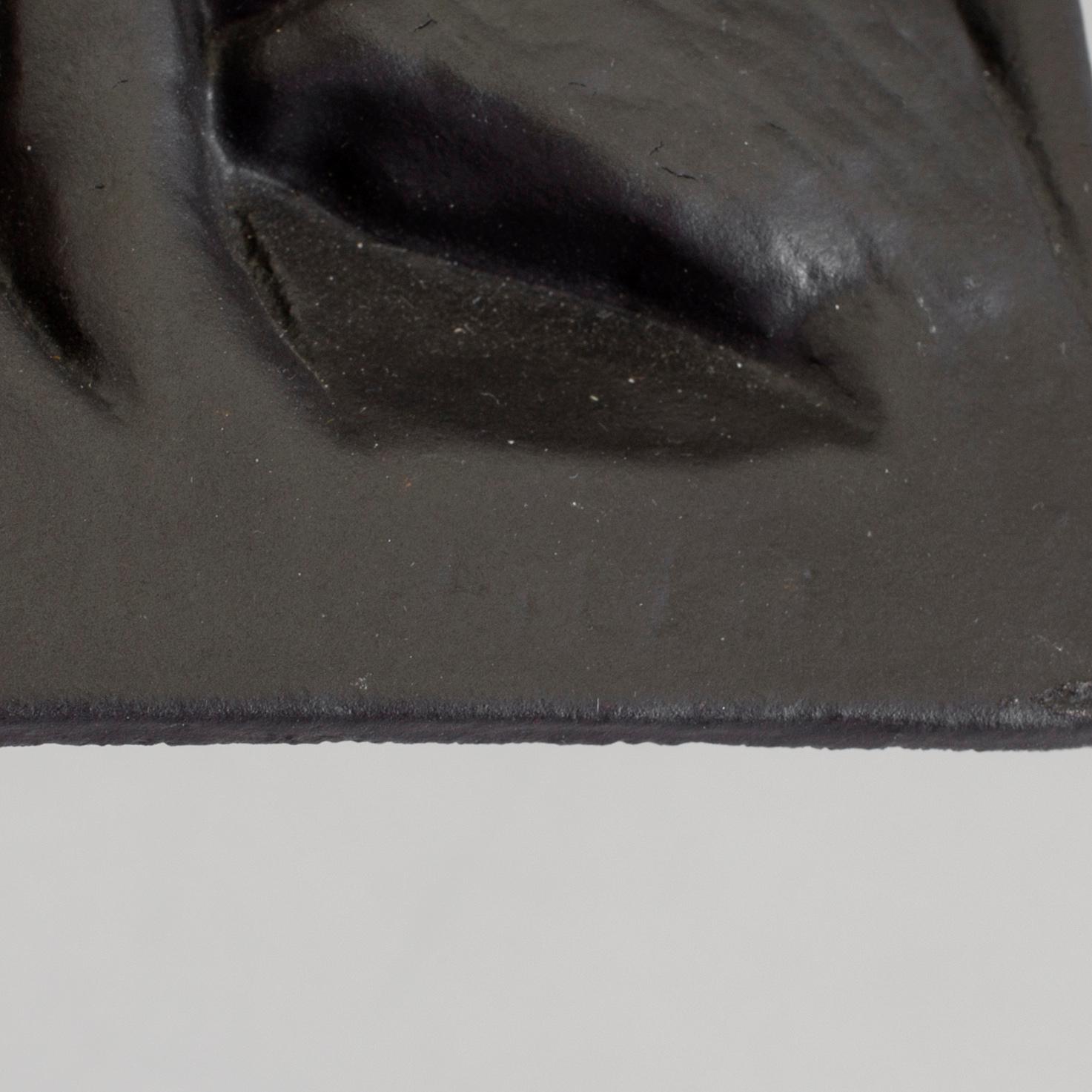 MICHAEL SCHILKIN, a cast iron plaque "See no evil, hear no evil, say no evil", signed and dated Högfors 1961.