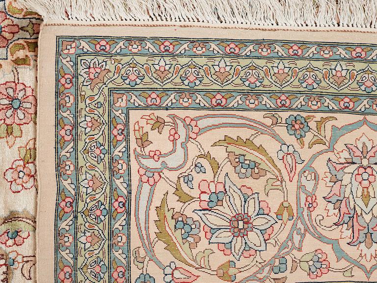 A CARPET, an old silk Turkey, ca 428 x 299-307 cm.