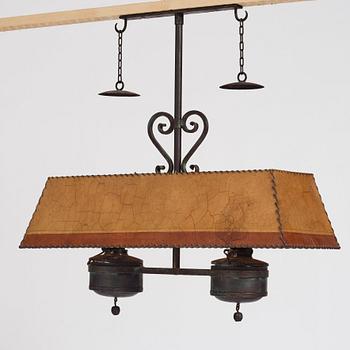 Nordiska Kompaniet, a patinated metal ceiling light for a Swedish "Sportstuge" interior, 1930's.