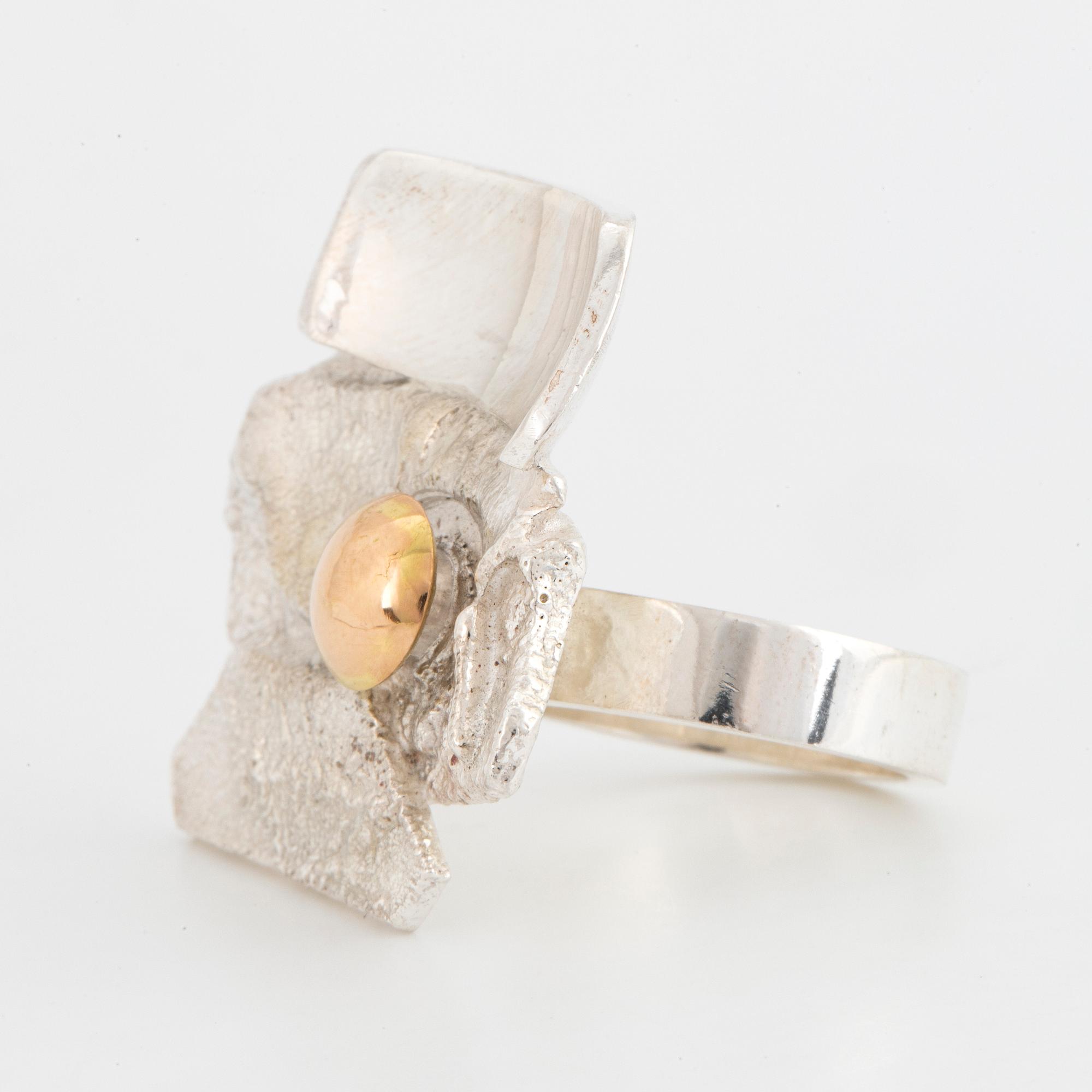 Sterling silver and 18K white gold detail ring by Rolf Karlsson.