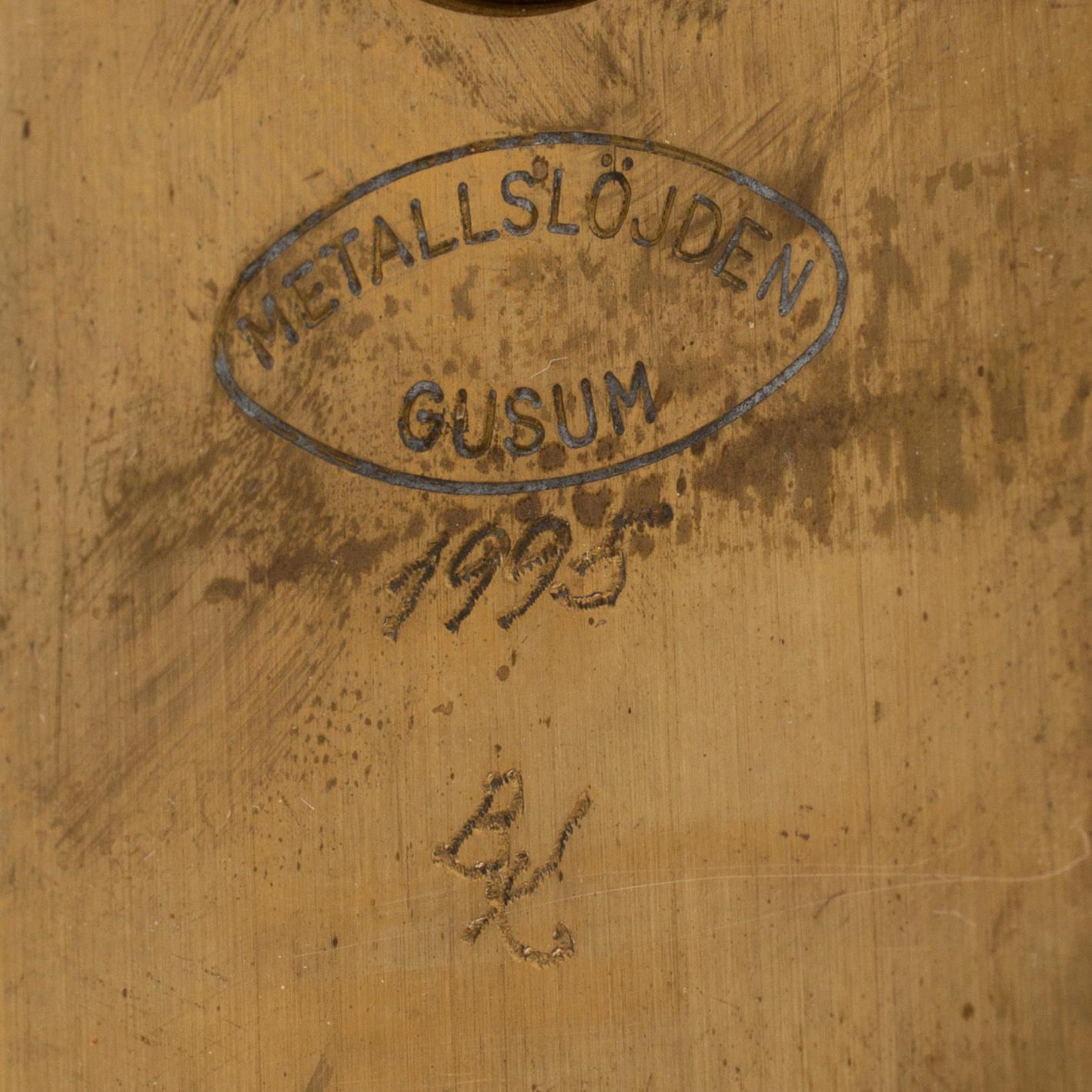 A pair of brass wall candelabras, for Gusum, signed BK and dated 1995 and 1997.