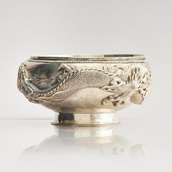 A Chinese double walled 'dragon' silver bowl, Shanghai, around 1900.