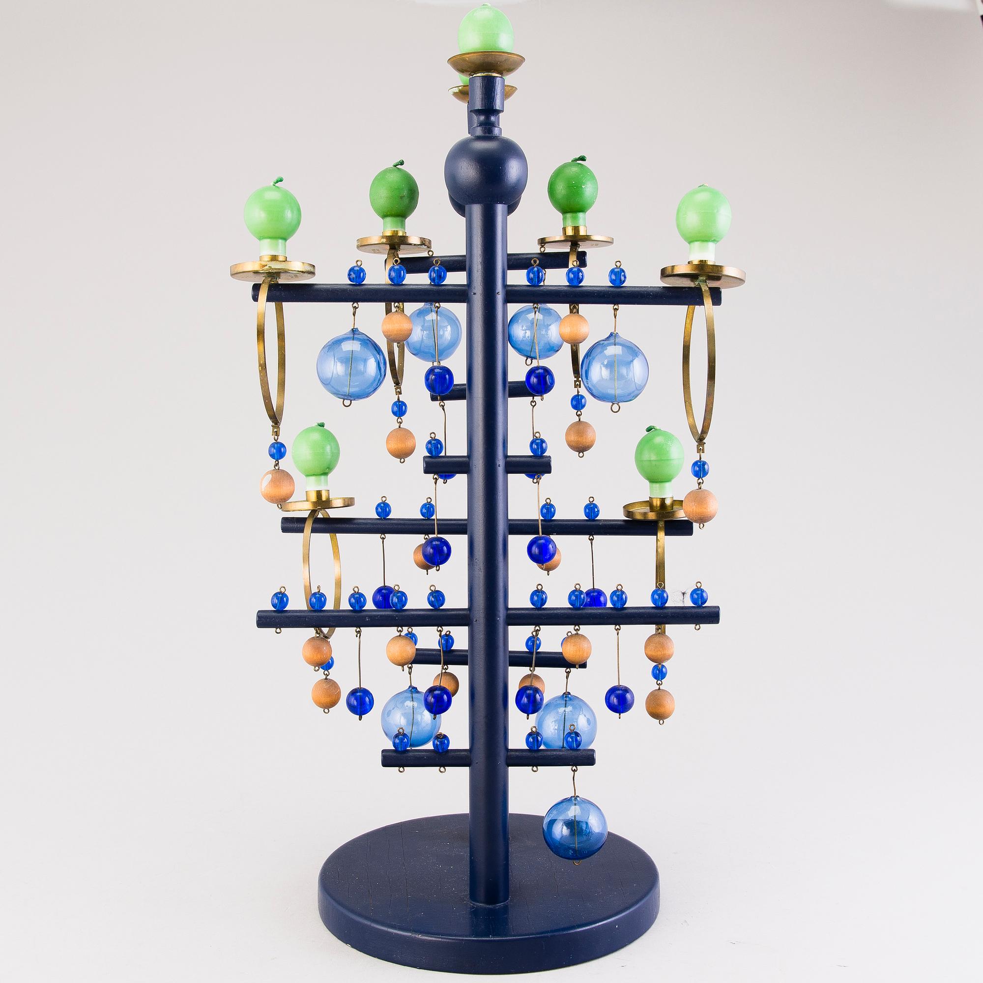 KYNTTELIKKÖ, Design Kaija Aarikka, 'Lapsuuteni joulu', Aarikka. Suunniteltu 1965.