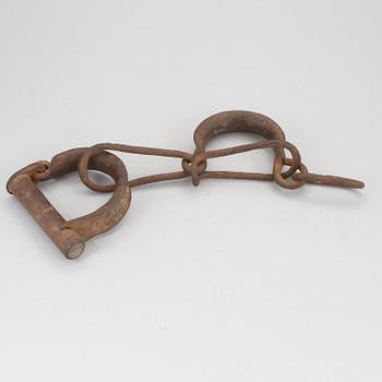 A pair of 1800s handcuffs.