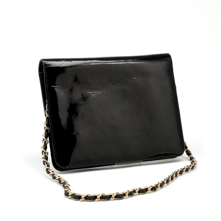 CHANEL, a black patent leather flap bag.