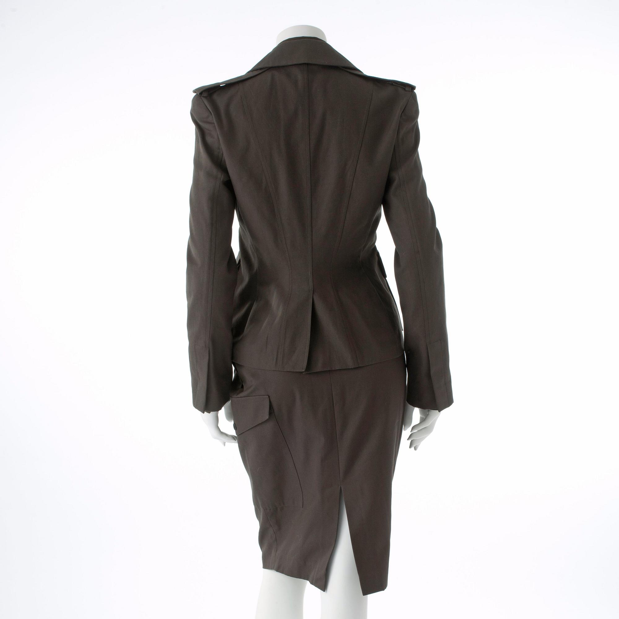 GUCCI, a three-piece suit consisting of jacket, shirt and skirt.