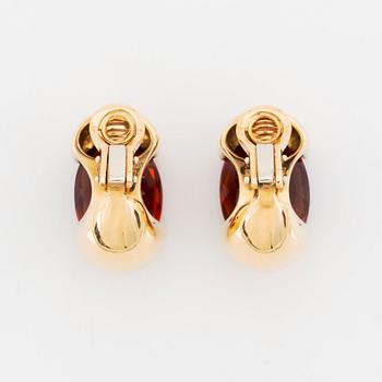 A pair of Tina Karlsson earrings in 18K gold set with faceted citrines.