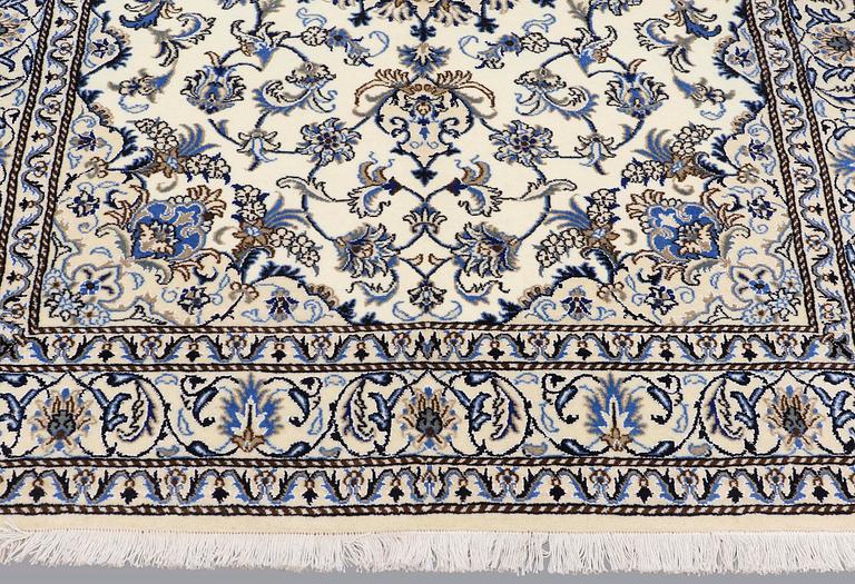A rug, Nain part silk, ca 235 x 160 cm.