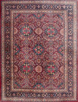 A semi-antique Mashad carpet, East Persia, signed Gahzi Khan, c. 410 x 310 cm.