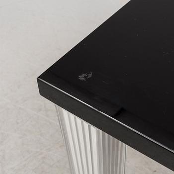 A "Tip Top" dining table by Philippe Starck for Kartell.