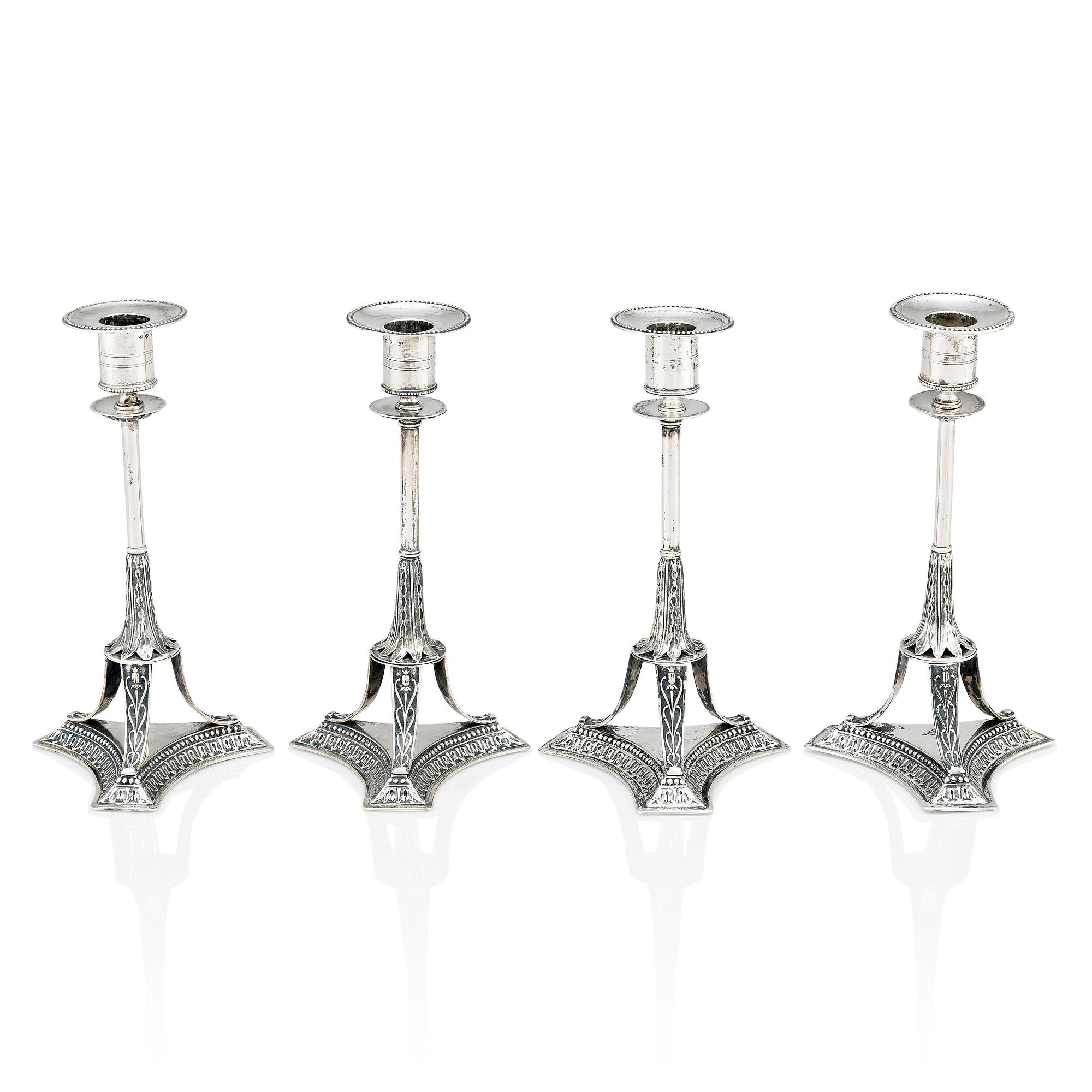 Four Swedish early 19th Century silver candlesticks, mark of Adolf Zethelius, Stockholm 1814 and 1818.