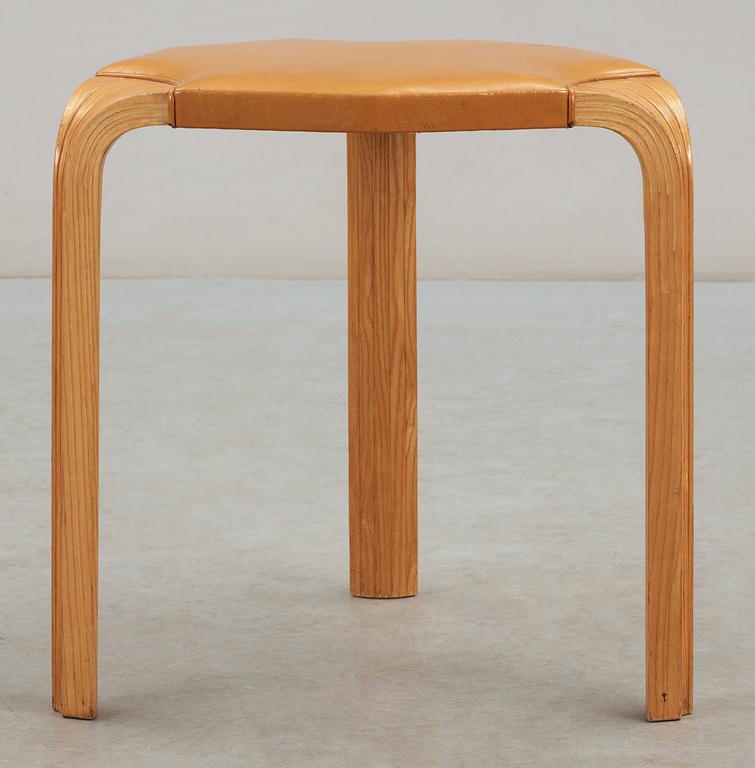 An Alvar Aalto 'X600' birch and yellow leather stool, Artek, Finland.
