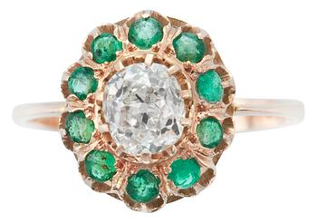 A RING, old cut diamond c. 0.70 ct and emeralds.