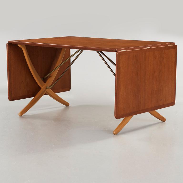 Hans J. Wegner, a teak and beech dining table by Andreas Tuck, Denmark 1950-60's.