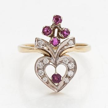 A 14K gold ring with diamonds ca. 0.14 ct in total and rubies.