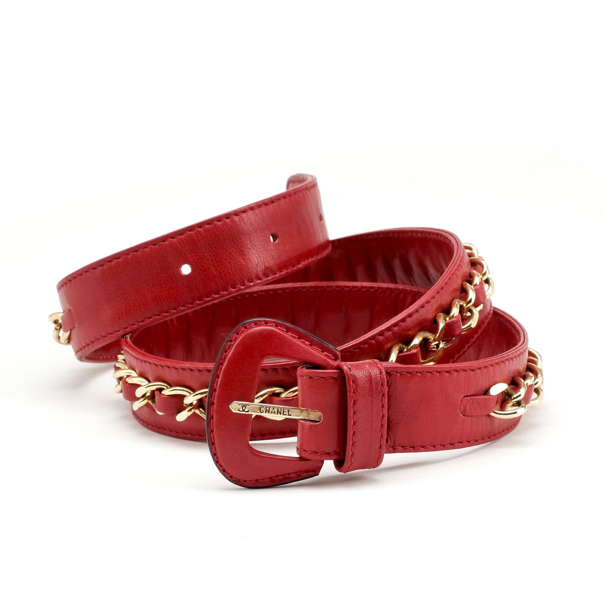 CHANEL, a red leather and gold chain belt.