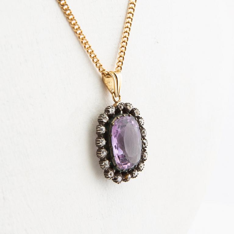 Pendant, 18k gold with diamonds and purple stone.