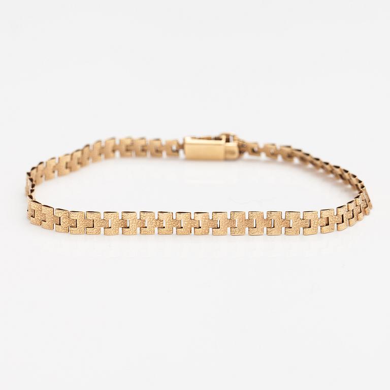 Rannekoru, 14K kultaa. Keravan Kultaseppä, Helsinki 1973.