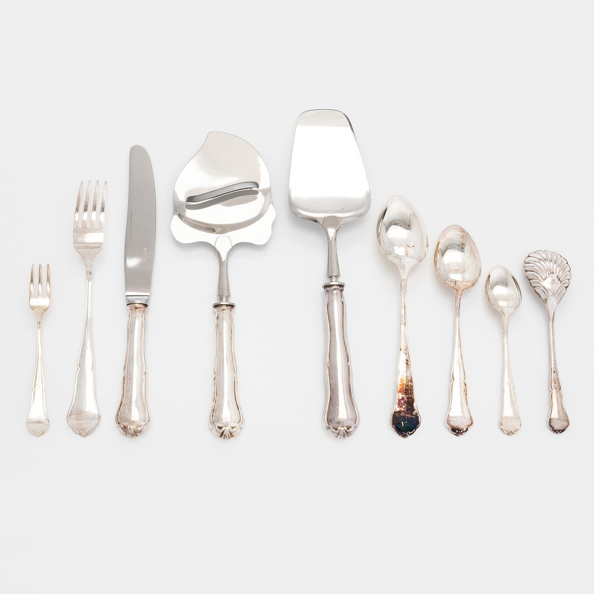 A 59-piece silver 'Chippendale' cutlery set, 20th century. Various Finnish manufacturers.