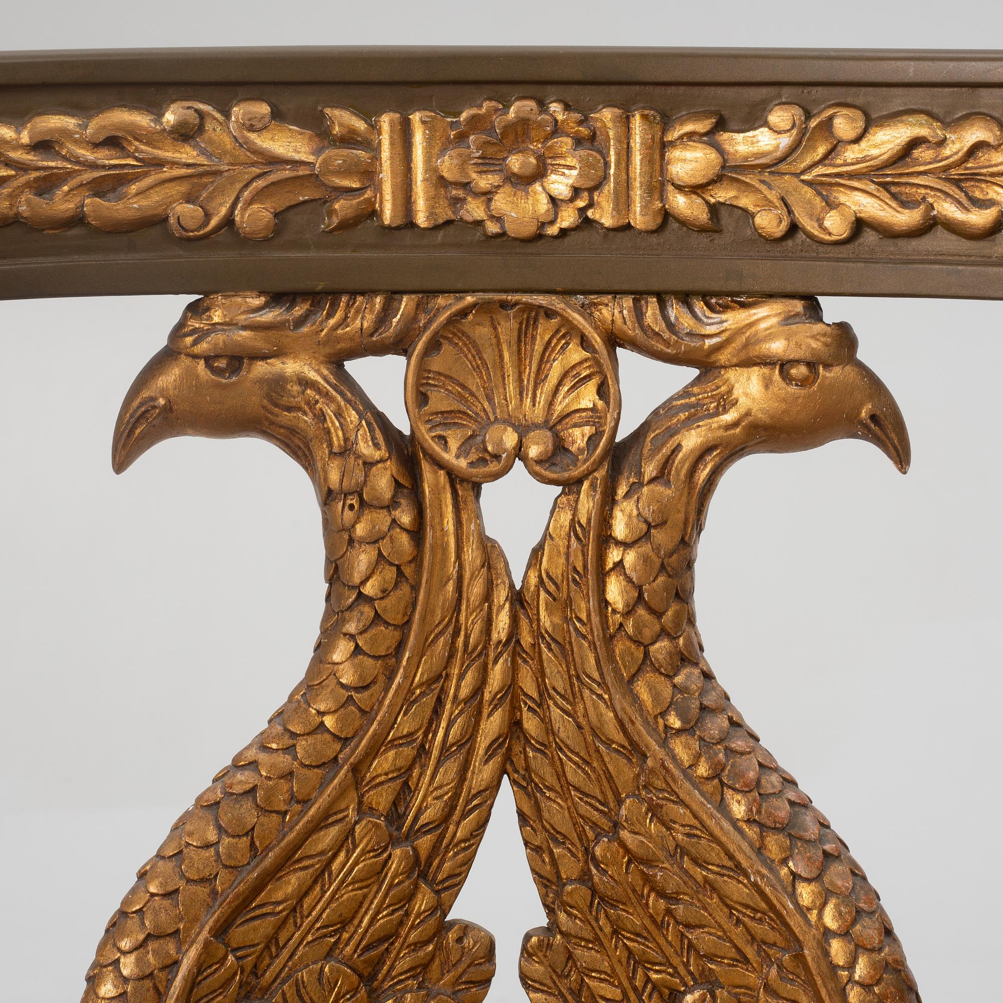 A pair of chairs and a side table, second half of the 20th century. Empire style.