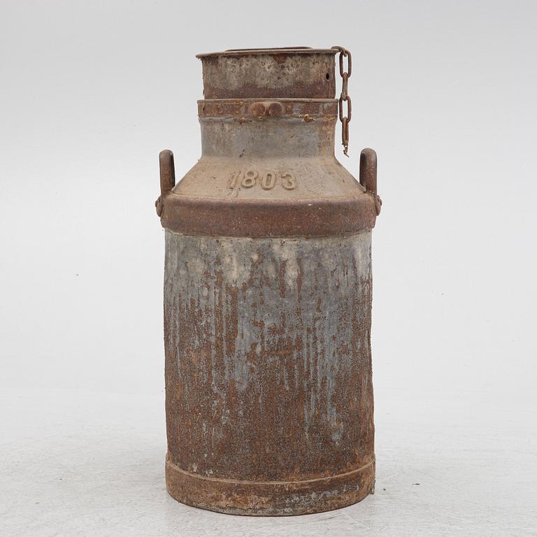 A milk pail, numbered 1803.