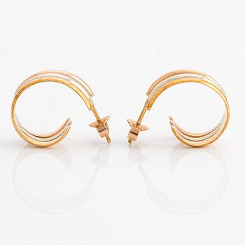 A pair of 18K gold Cartier earrings.