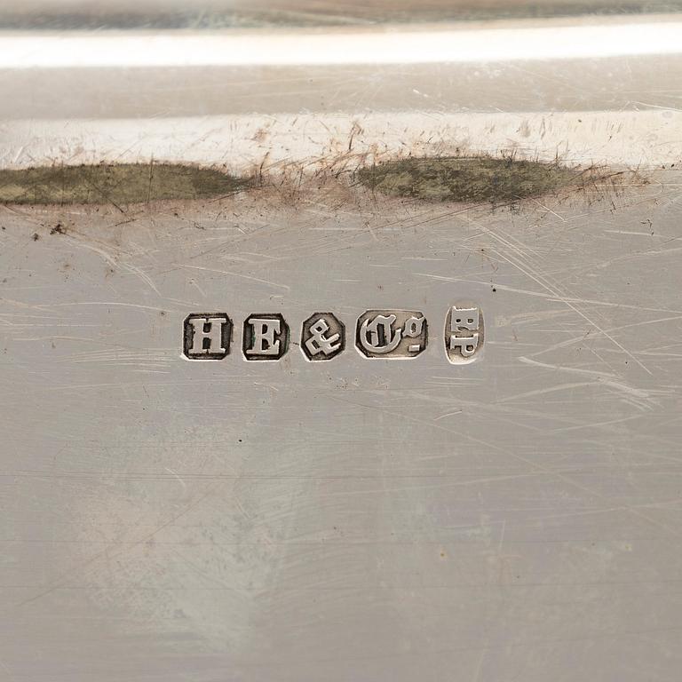 A set of four silver plated entree dishes, England.