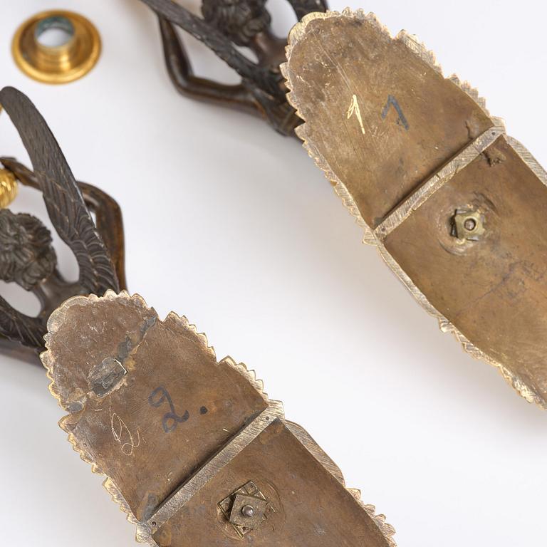 A pair of French Empire five-branch gilt and patinated bronze appliques, first part 19th century.