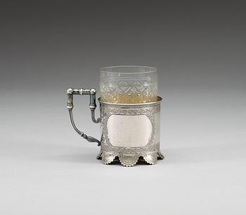 A RUSSIAN PARCEL-GILT TEA-GLASS HOLDER, un identified makers mark, Moscow 1884.