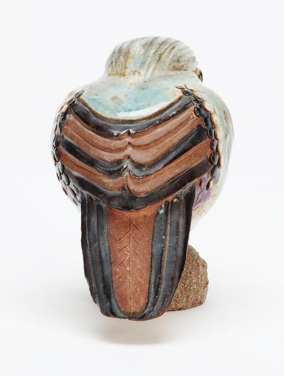 A Tyra Lundgren stoneware bird, signed with a seal.