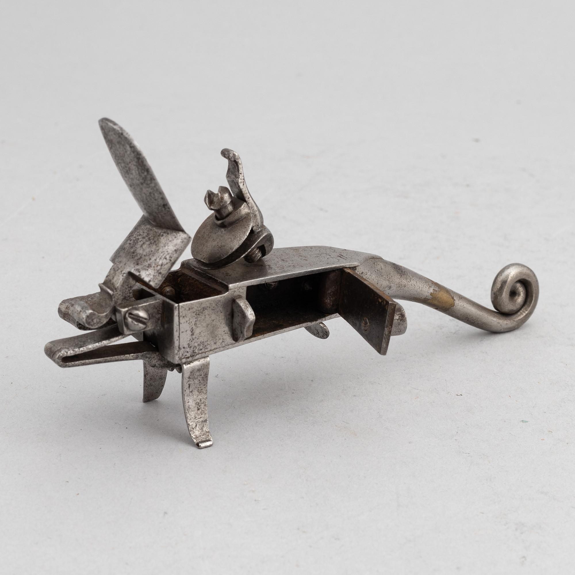 An 18th Century flintlock tinder lighter.