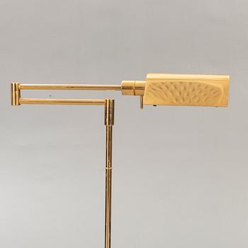 A brass floor lamp later part of the 20th century.