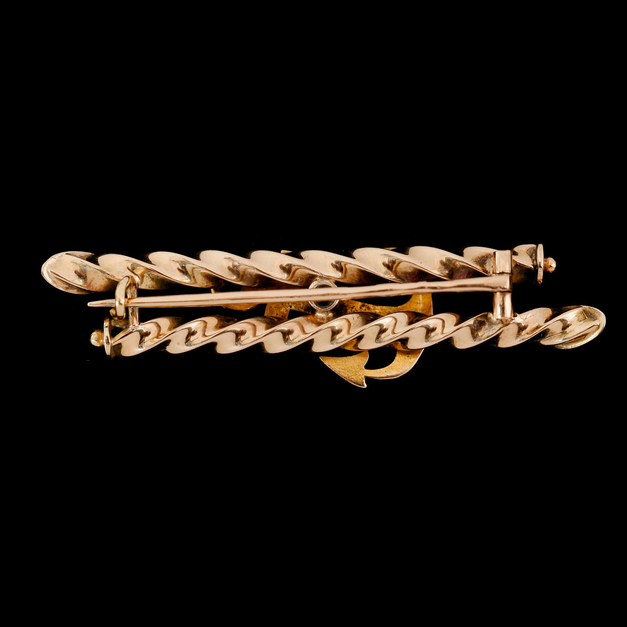 BROSCH, 14 k, guld, med turkoser. Total vikt ca 6 g.