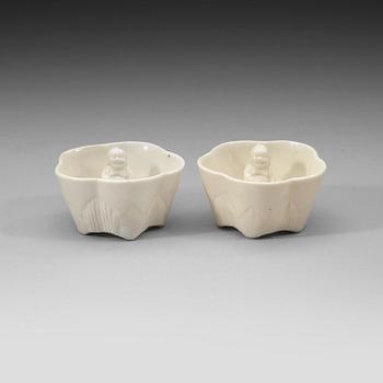 231. A pair of blanc de chine 'Trick cups', Qing dynasty.