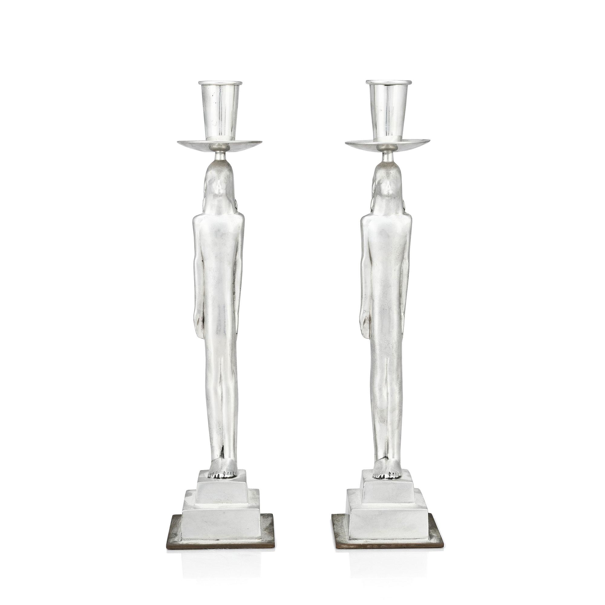 Edvin Öhrström, a pair of pewter and brass 'Egyptian' candlesticks, Svenskt Tenn, Sweden 1984.