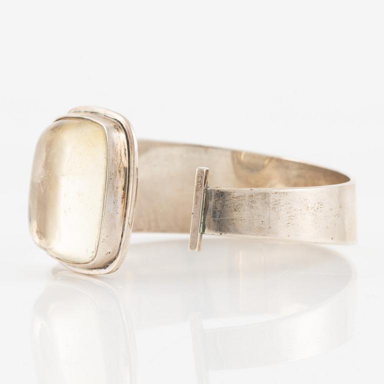 Bengt Liljedahl, arm ring, silver with light yellow stone.