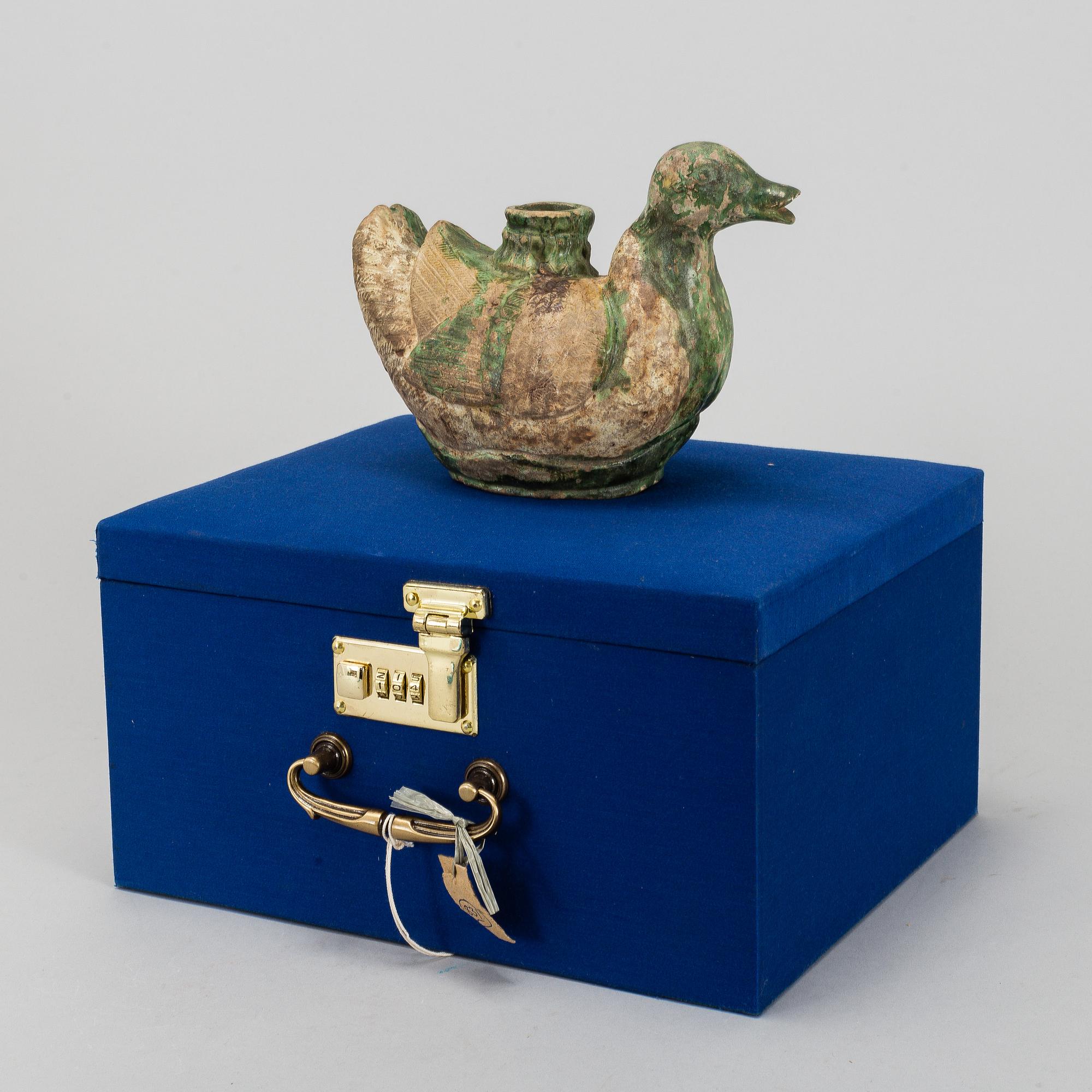 A green and yellow glazed bisquit duckshaped ewer, Ming dynasty (1368-1644).