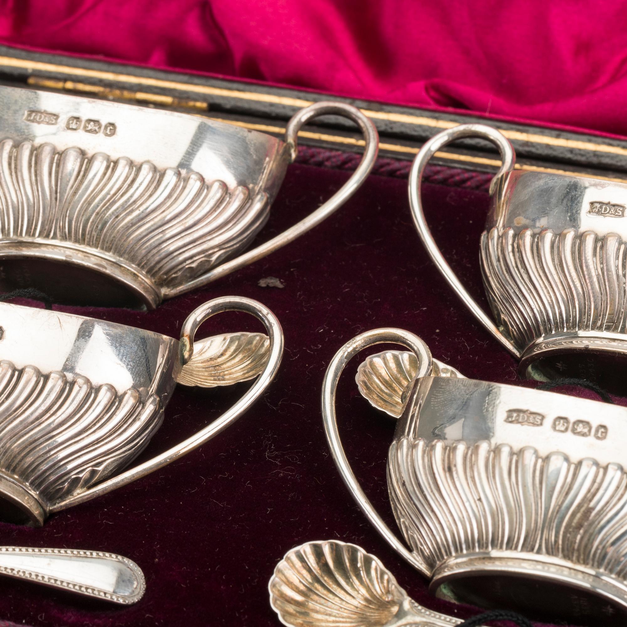 An English set of four silver salters with spoons mark of James Dixon & sons Sheffield 1895, weight 166 gr.