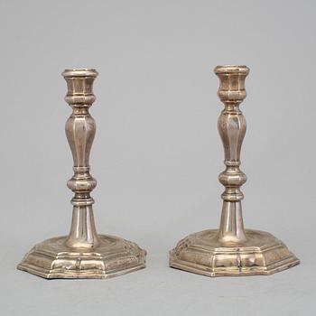 A pair of 18h century silver candlesticks, unidentified marks.