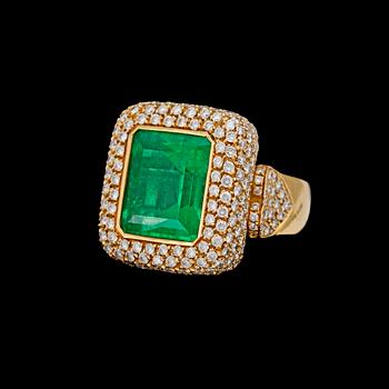 An important step cut emerald, app 15 cts and brilliant cut diamond ring, app. 6 ct.