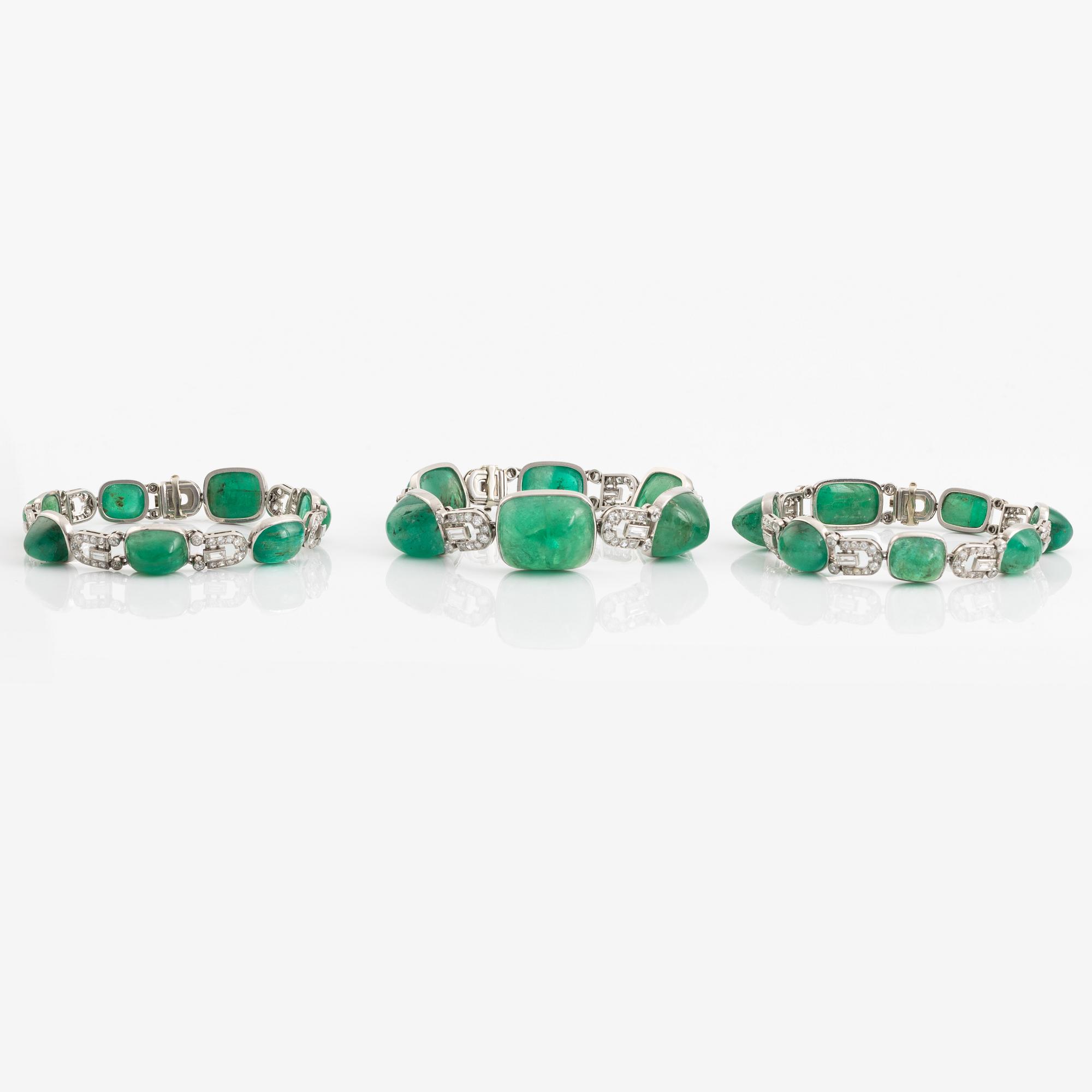 An art deco platinum necklace/bracelet combination with cabochon-cut emeralds.